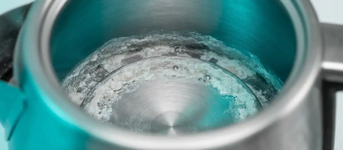 Kettle interior with visible limescale and mineral buildup